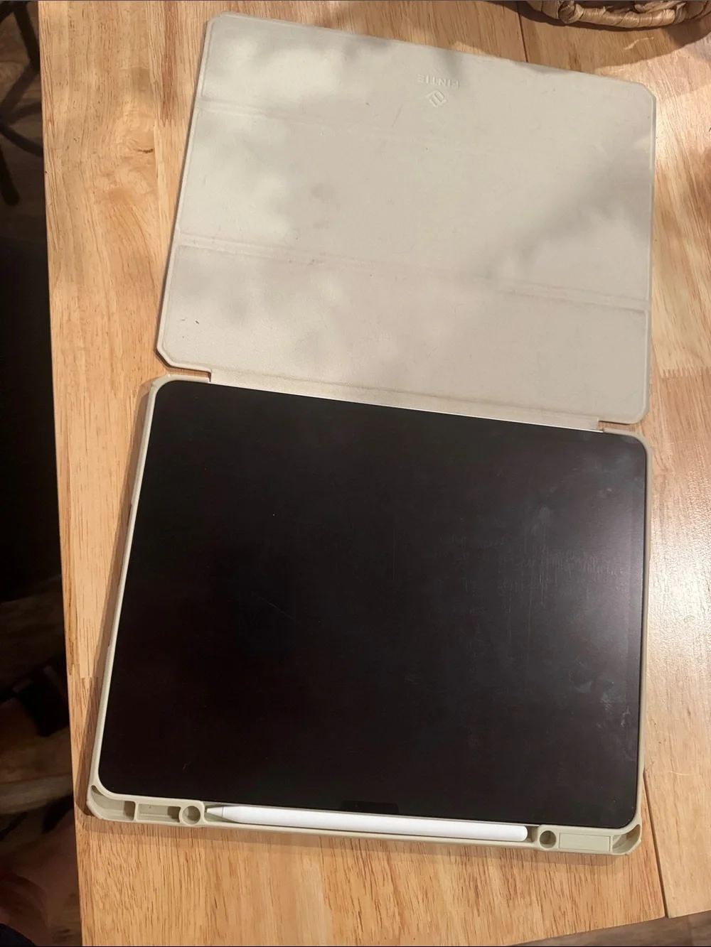 iPad Air with White Smart Cover and Stylus.